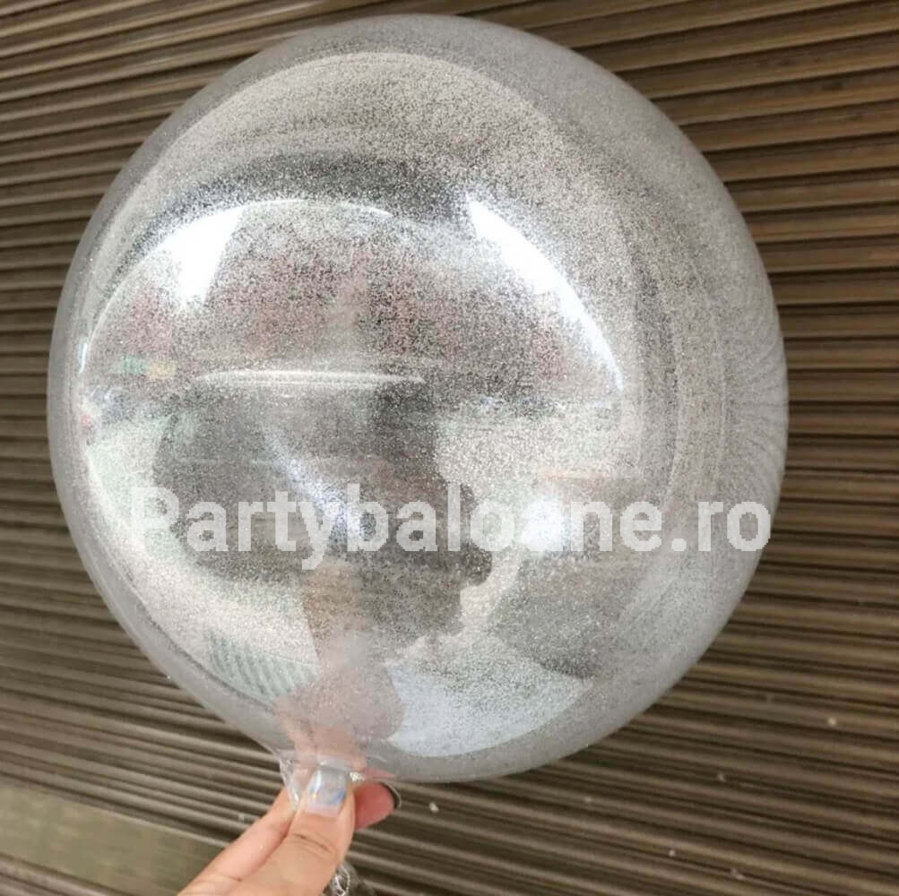 Balon Bobo Transparent cu Glitter Argintiu 50 cm Balon tip Bobo transparent de 50 cm cu glitter sclipici argintiu in interior pentru decoratiuni nunti si aniversari.