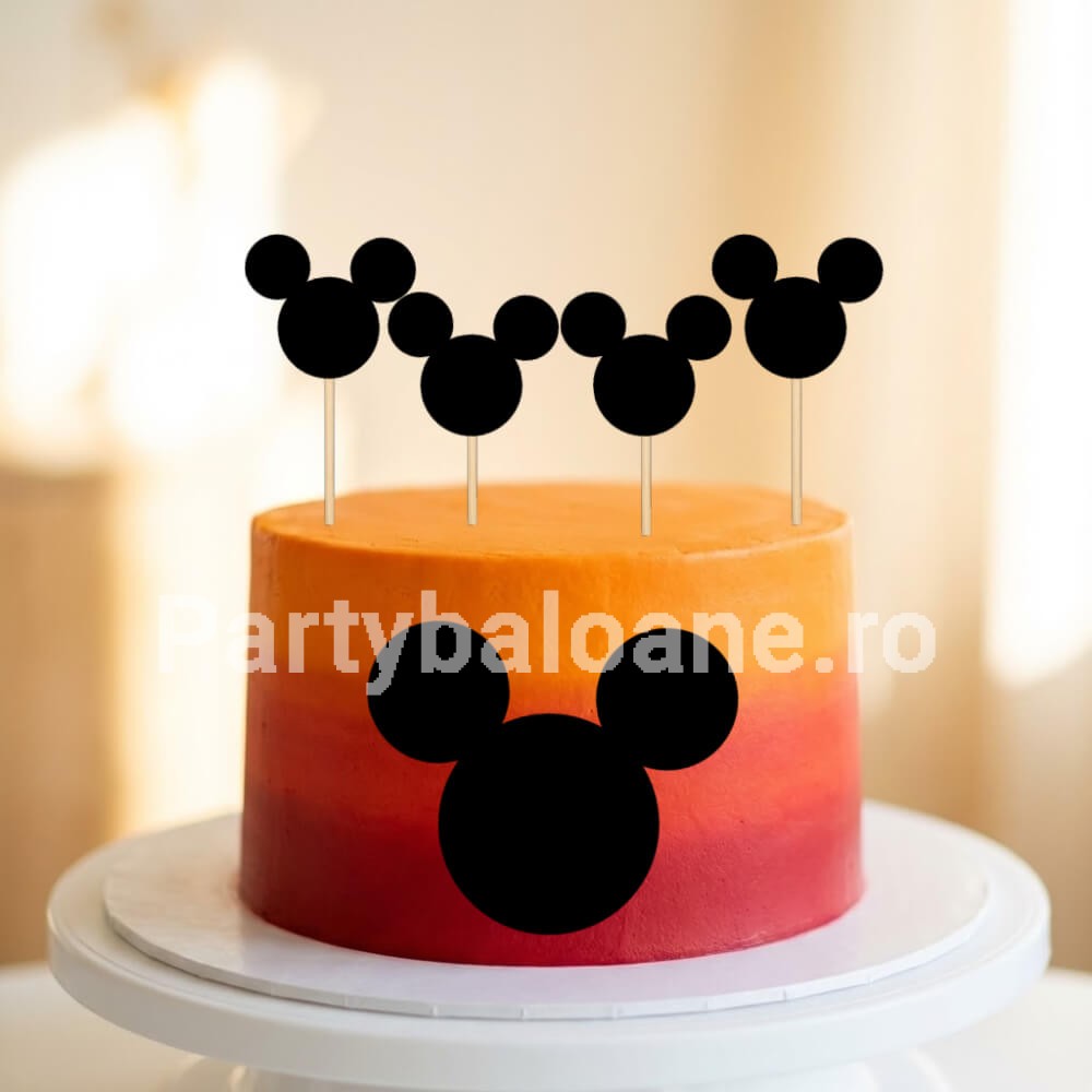 Set 4 Toppere Tort Cap Mickey Mouse Negru – Decor Siluetă Carton Set 4 toppere decorative negre din carton forma silueta cap Mickey Mouse infipte in partea de sus a unui tort aniversar portocaliu