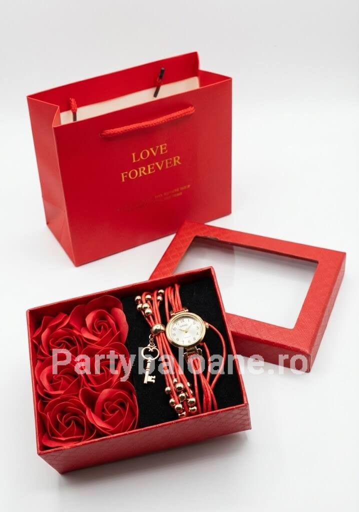 Set Cadou Premium Ceas Elegant de Damă și Trandafiri de Săpun Parfumați (Include Pungă Cadou) Set cadou premium in cutie rosie continand ceas de dama elegant cu finisaj auriu si sase trandafiri rosii din sapun parfumat alaturi de punga de cadou
